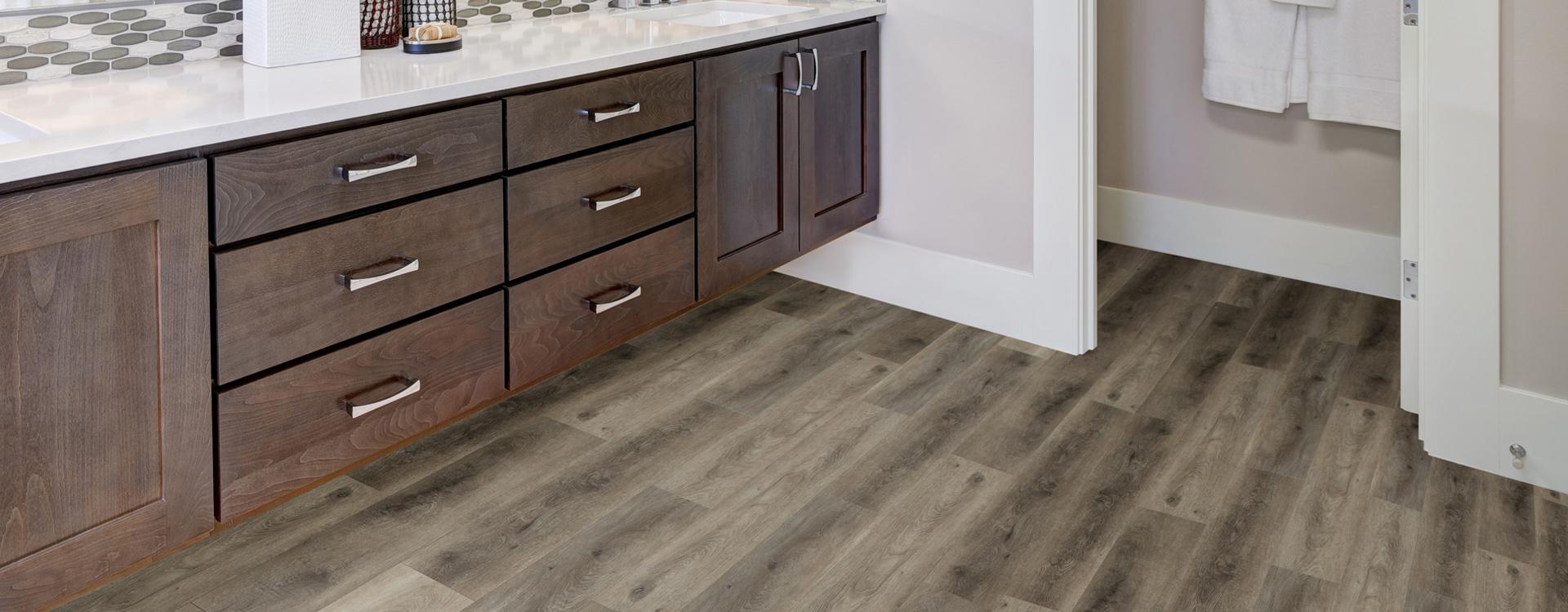 Horizen Flooring presents to you a picture of a quality wide plank Bungalow luxury vinyl plank. NovoCore Premium EIR collection features a wide range of colors & designs that will compliment any interior. Natural wood grain synchronized surface allow for an authentic hardwood look & feel. This collection features a 0.25″ / 6.5 mm overall thickness and a durable 22 mil / 0.55 mm wear layer for residential and commercial applications.