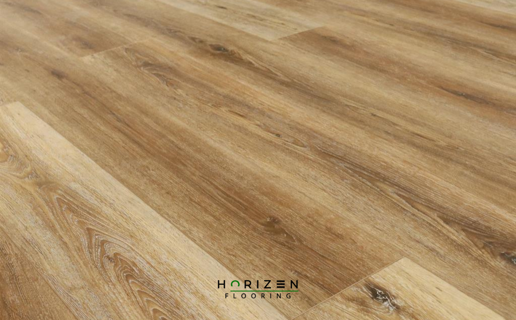 Horizen Flooring presents to you a picture of a quality wide plank Peridot Drift luxury vinyl plank. LW Flooring Riverstone collection features a wide range of colours & designs that will compliment any interior. Natural wood grain synchronised surface allow for an authentic hardwood look & feel. This collection features a 5.5 mm overall thickness and a durable 20 mil wear layer for residential and commercial applications.